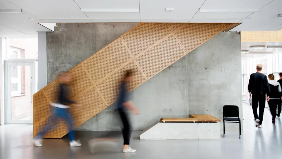 Students in motion blur in the M-Building. Photo. 