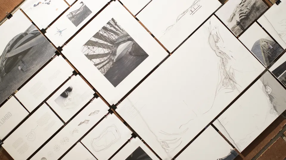 Different sized papers, with architectural images. Photo. 