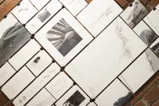 Different sized papers, with architectural images. Photo. 