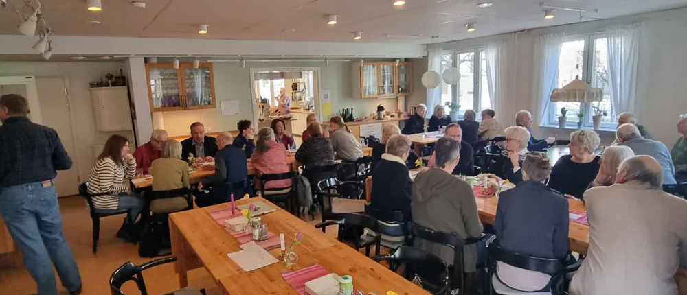 Group of people talking in a canteen. Photo.