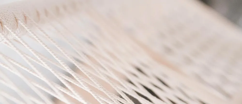 Strings in a pattern symbolising networks. Photo.