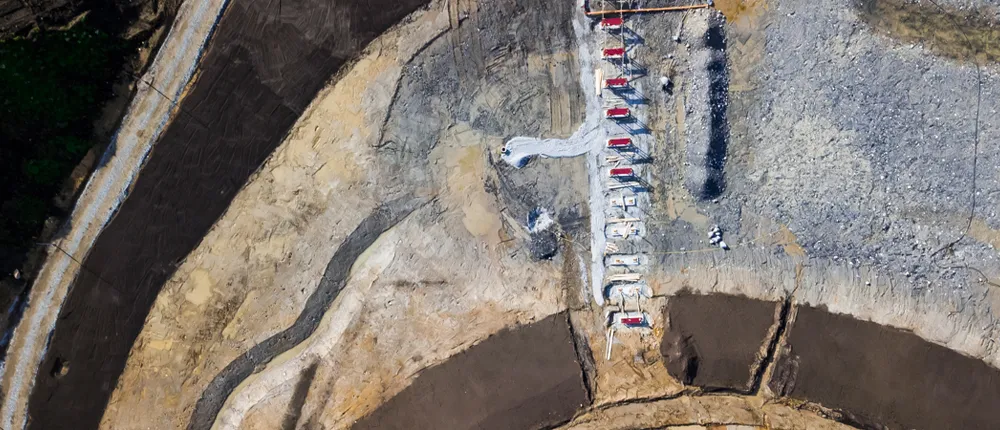 Helicopter shot of architectural construction in mountain area. Photo.