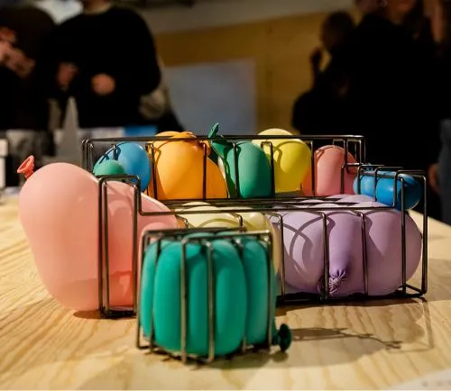 Balloons in different colours inside baskets. Photo.