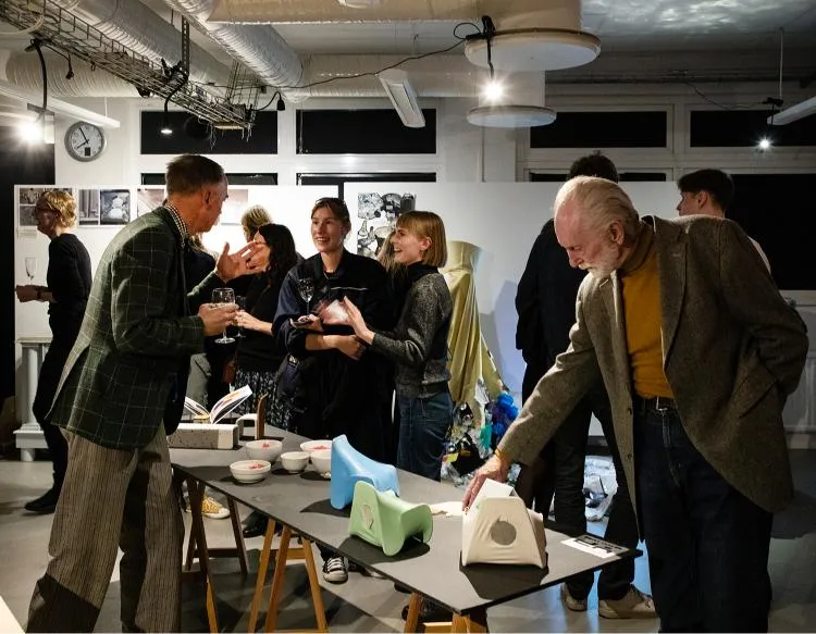 Guests at Exhibition. Photo. 