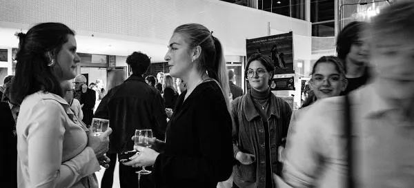 People in Exhibition Hall. Photo. 