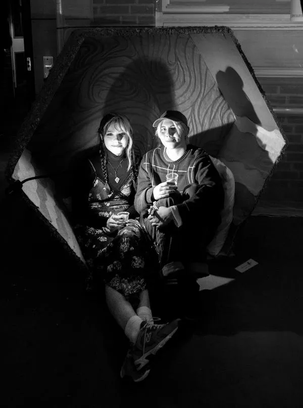 Young couple in chair. Photo. 