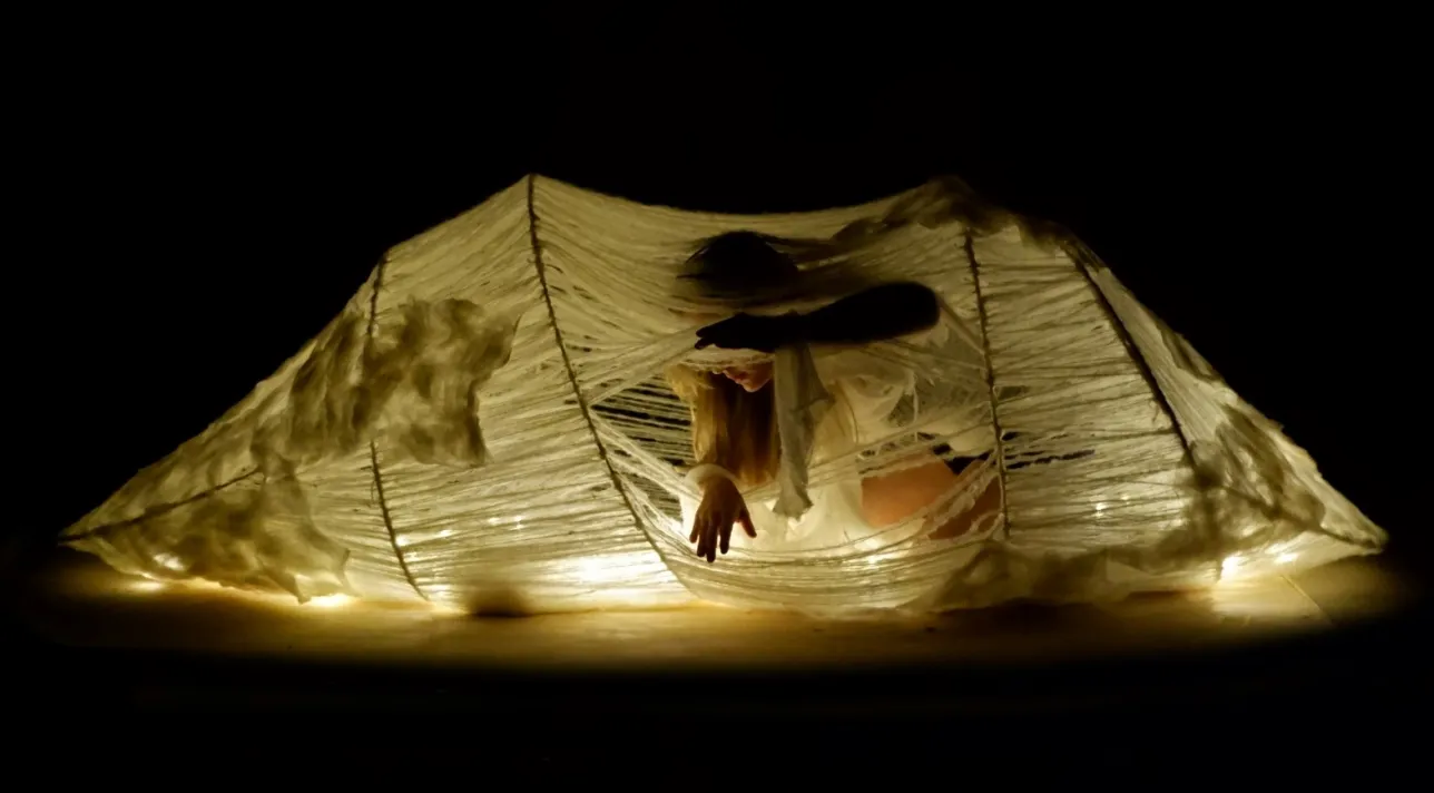 Woman pulling the strings. Photo. 