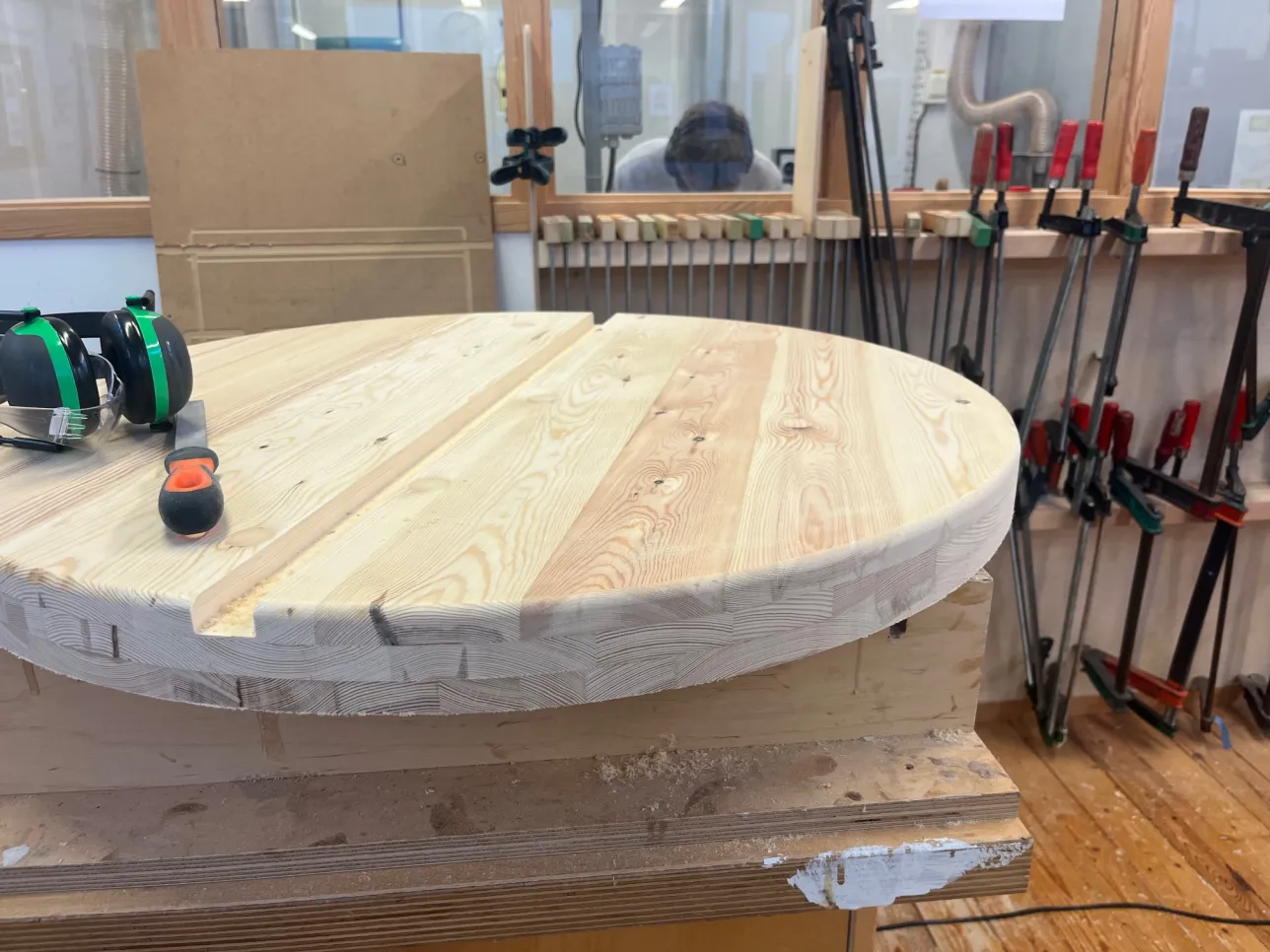 Wooden round table in building process. Photo.