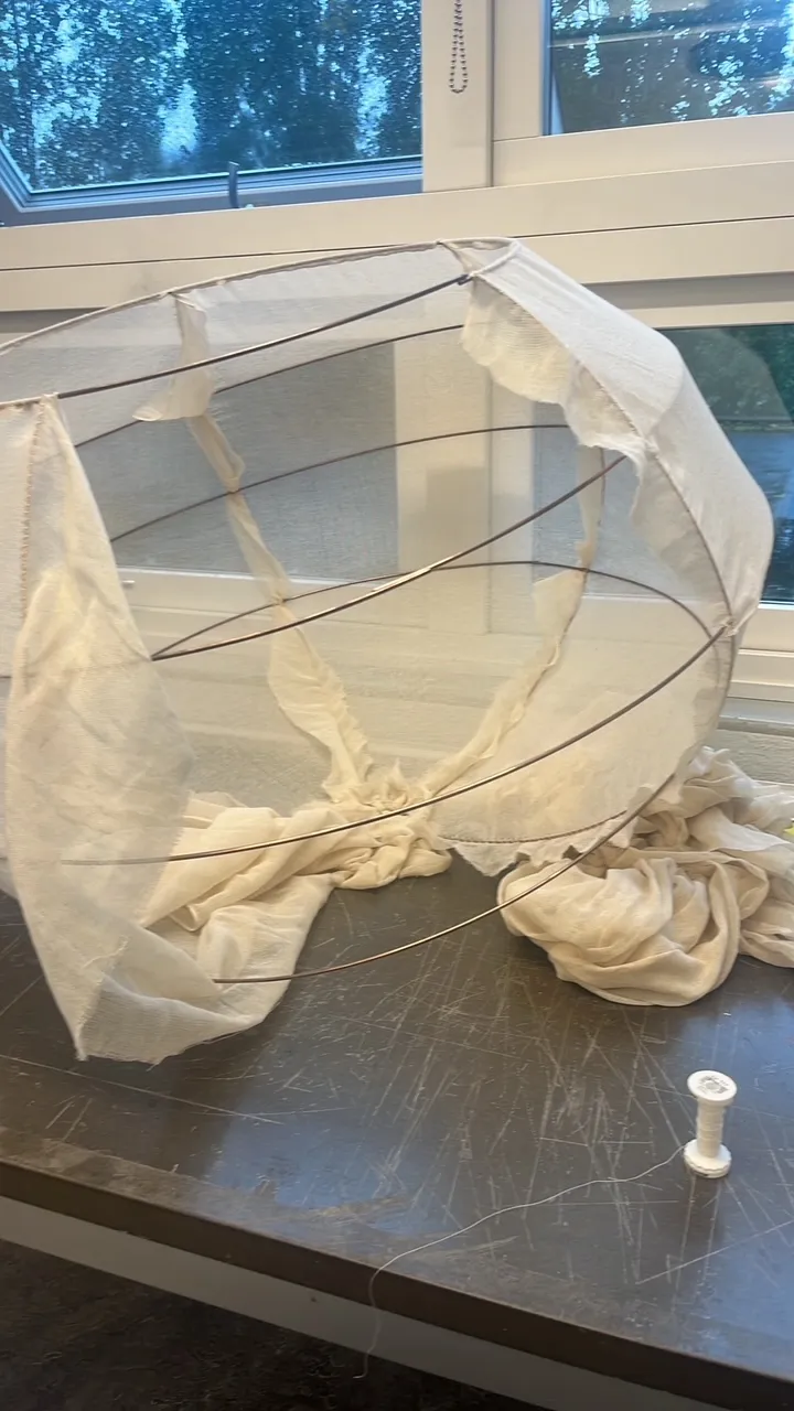 Translucent round fabric lampshade. Photo.