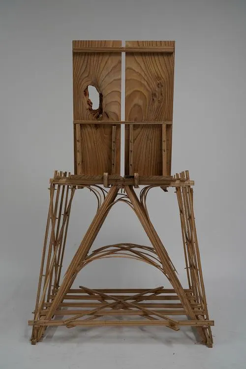 A wooden chair sculpture. Photo.