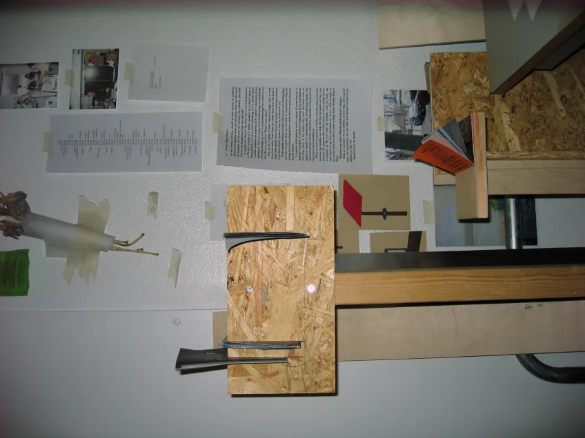 Exhibition display of woodpieces and paper. Photo.